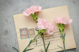 a letter with flowers on it