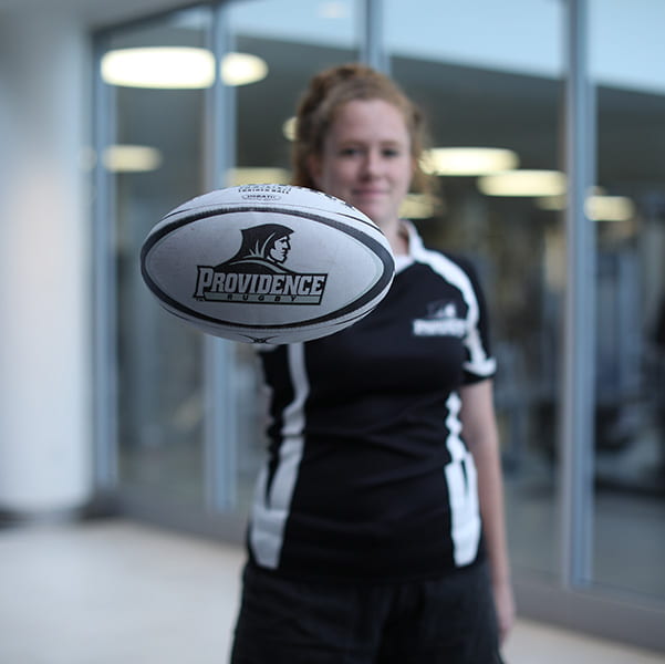 rugby player holds ball