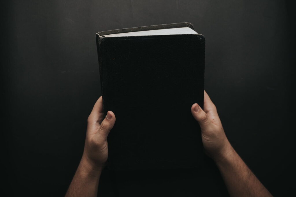 Hands holding a book