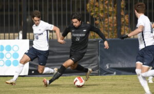 Christopher Roman ’22 (above) takes on a Georgetown defender during the Big East Championship. Roman has been one of the Friars’ key attacking players on the right flank. 