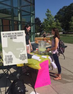 A PC student buys lemonade to support relief efforts for Hurricane Harvey.
