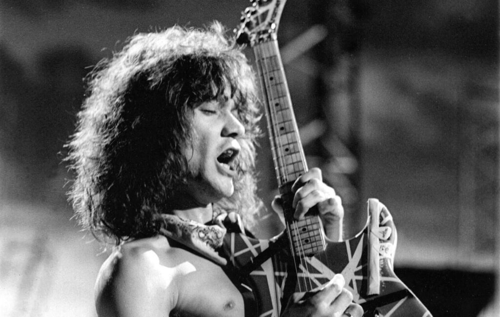 Black and white photograph Eddie Van Halen playing guitar