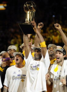 Bryant lifts the Larry O'Brien Trophy in 2010