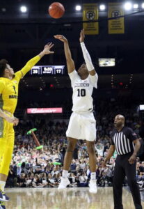 A.J. Reeves takes a jumpshot against Marquette at the Dunkin Doughnut center