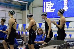 Women's Relay Team cheers on fellow swimmers