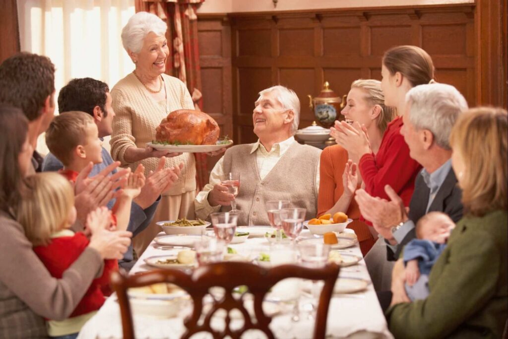 Family sitting down for a thanksgiving dinner