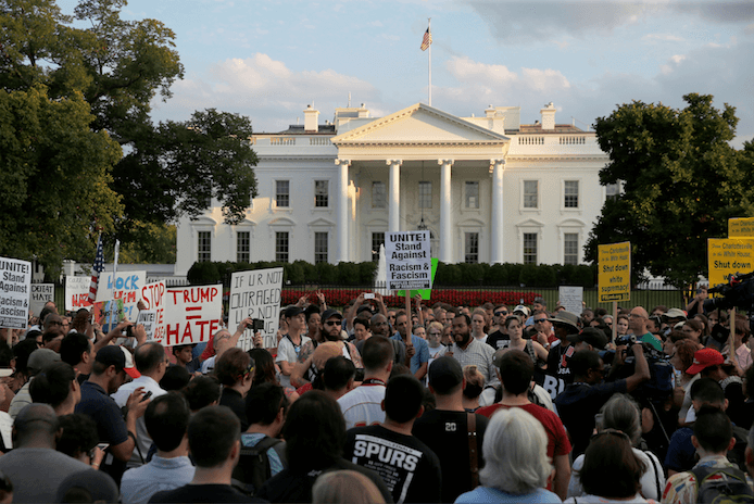 Citizens holding a vigil outside the White House for the violent attack in Charlottesville.