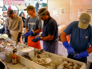 Locals enjoy fresh seafood at the 27th Annual Bowen's Wharf Seafood Festival in Newport.