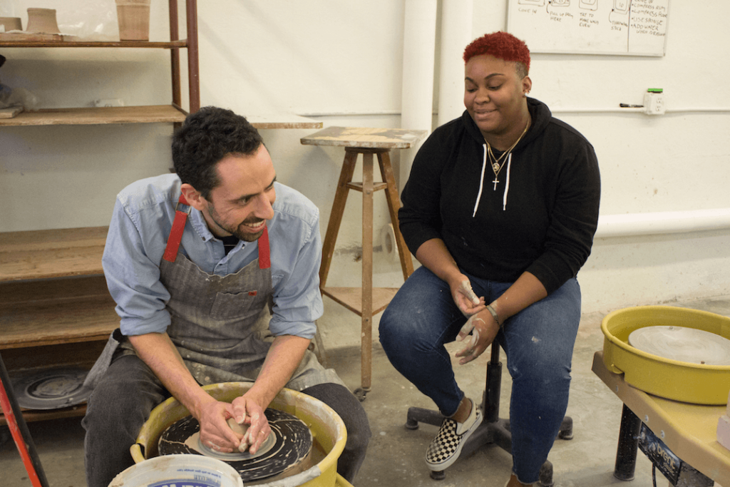 A Providence College professor and student collaborating in an independent study.