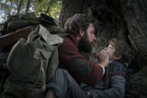 John Krasinski (left) and Noah Jupe (right) keeping quiet to avoid the “sound-hunting monsters.”
