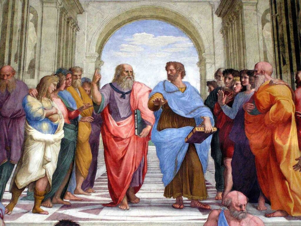 Photo of Aristotle surrounded by people.