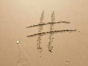 hashtag written in sand