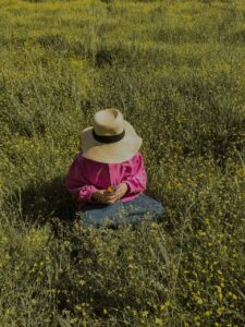 person sitting in the grass