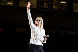 Doris Burke waves to the Providence College crowd during late night madness.