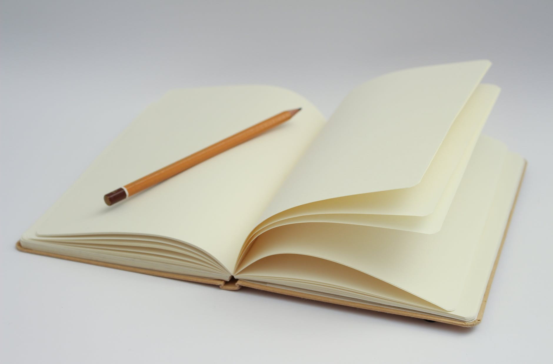 A pencil laying flat on a journal