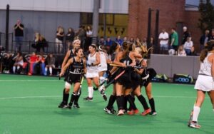 field hockey players celebrate