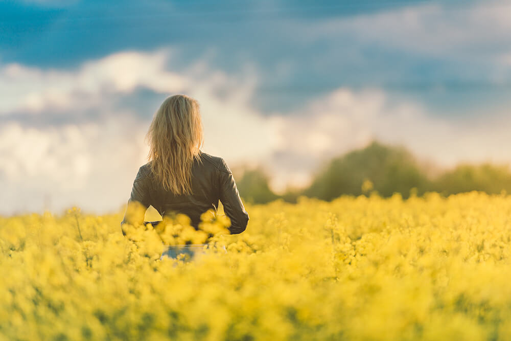 woman in flowery meadow