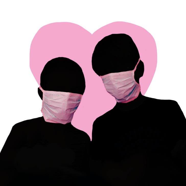 A couple in coughing masks with a pink heart in the background