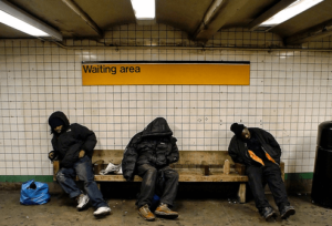 Homeless men in a subway station