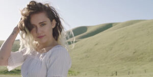 Miley Cyrus in her new music video for the first single, “Malibu,” off her latest album, Younger Now.