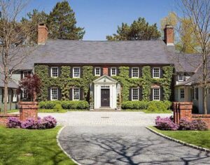 Old brick house covered in ivy