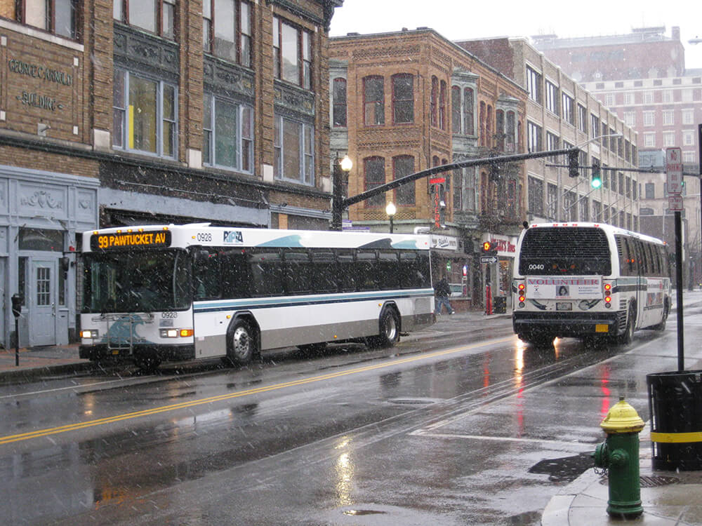 RIPTA buses driving on a street