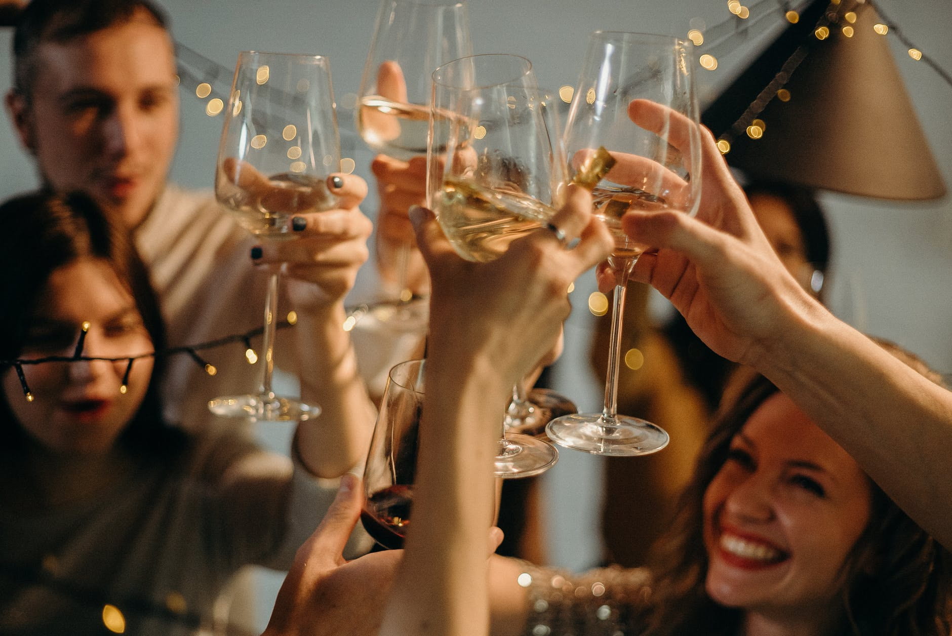 People raising their champagne glass in a toast