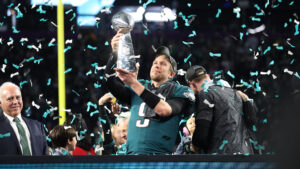 nick foles raises the Vince Lombardi Trophy