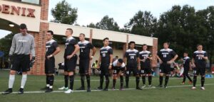 Men's Soccer team lines up before the game starts.