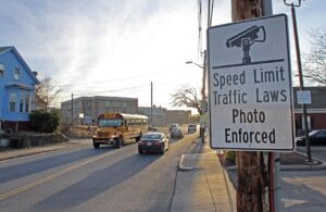 Signs in Providence, RI inform drivers of speed cameras, warning them to be cautious.