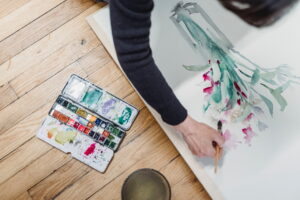 a person painting flowers