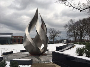 The torch statue at the Calabria Plaza on Slavin Lawn at Providence College